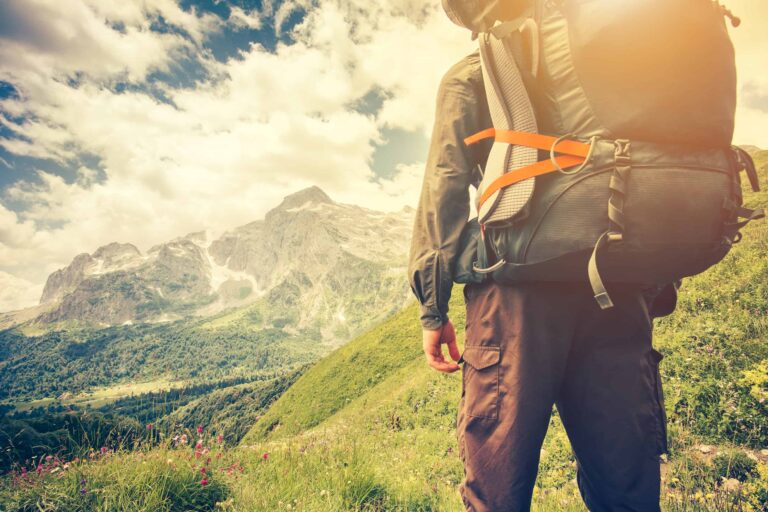 A man backpacking through the mountains