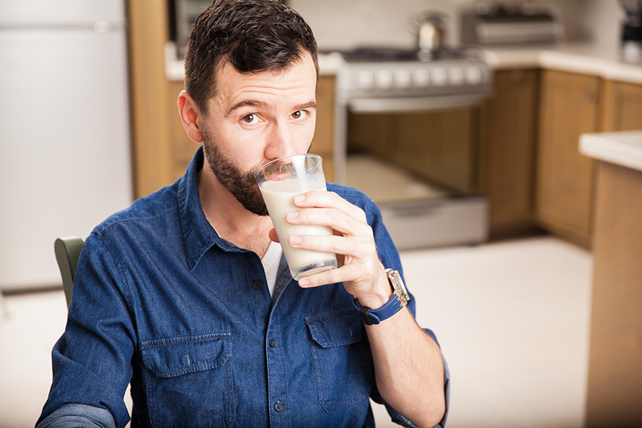 man with a cup of milk
