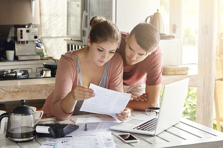 Couple looking at financial papers