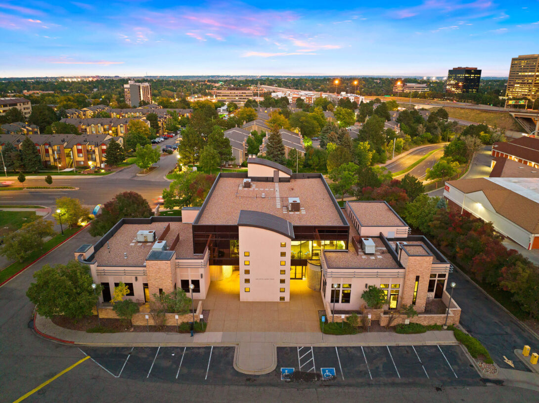 Aerial view of The Raleigh House building and surrounding area at twilight