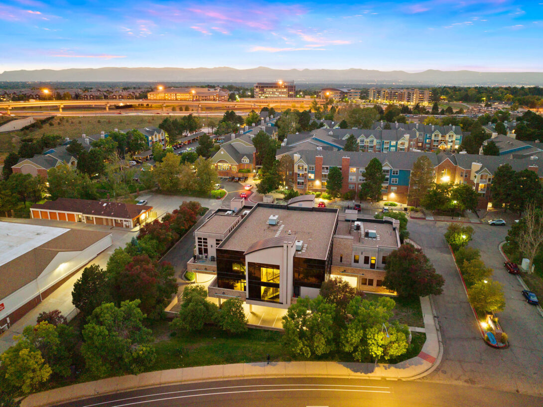 Aerial view of The Raleigh House building and surrounding area at twilight