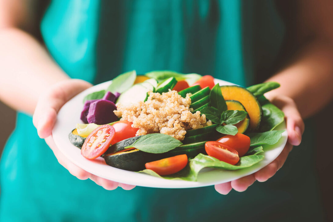 Person holding closeup of salad