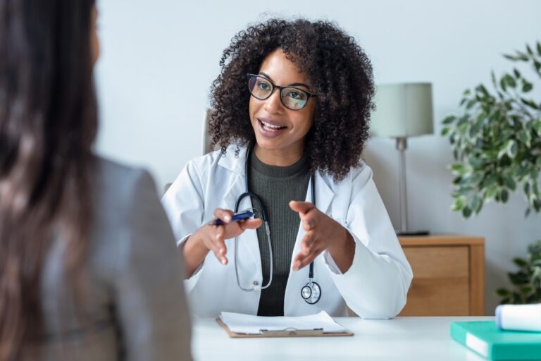 female doctor talking while explaining medical treatment to patient in the consultation.