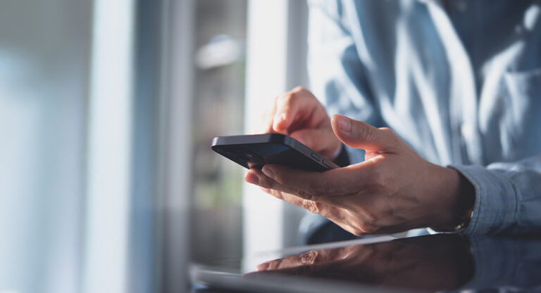 Person looking up info on his phone