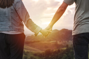 Close up of couple holding hands