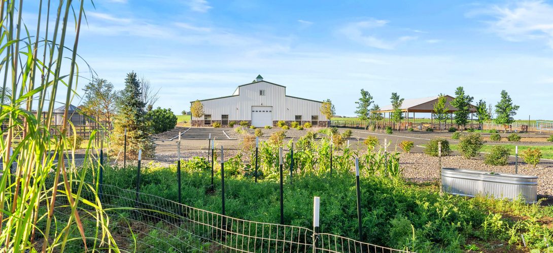 View of the garden and large white building